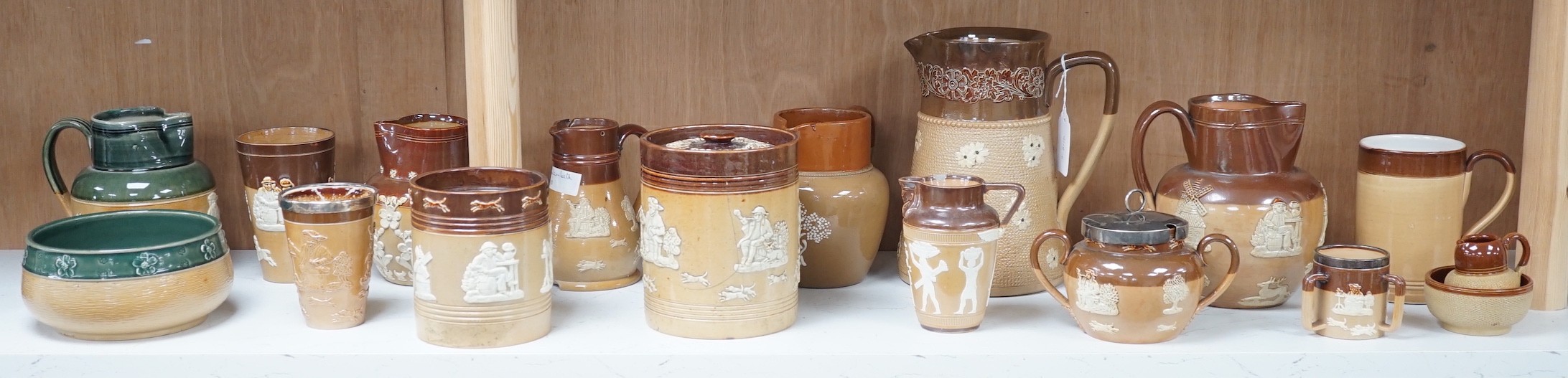 A group of Doulton stoneware jugs, storage jar, beakers, bowls etc